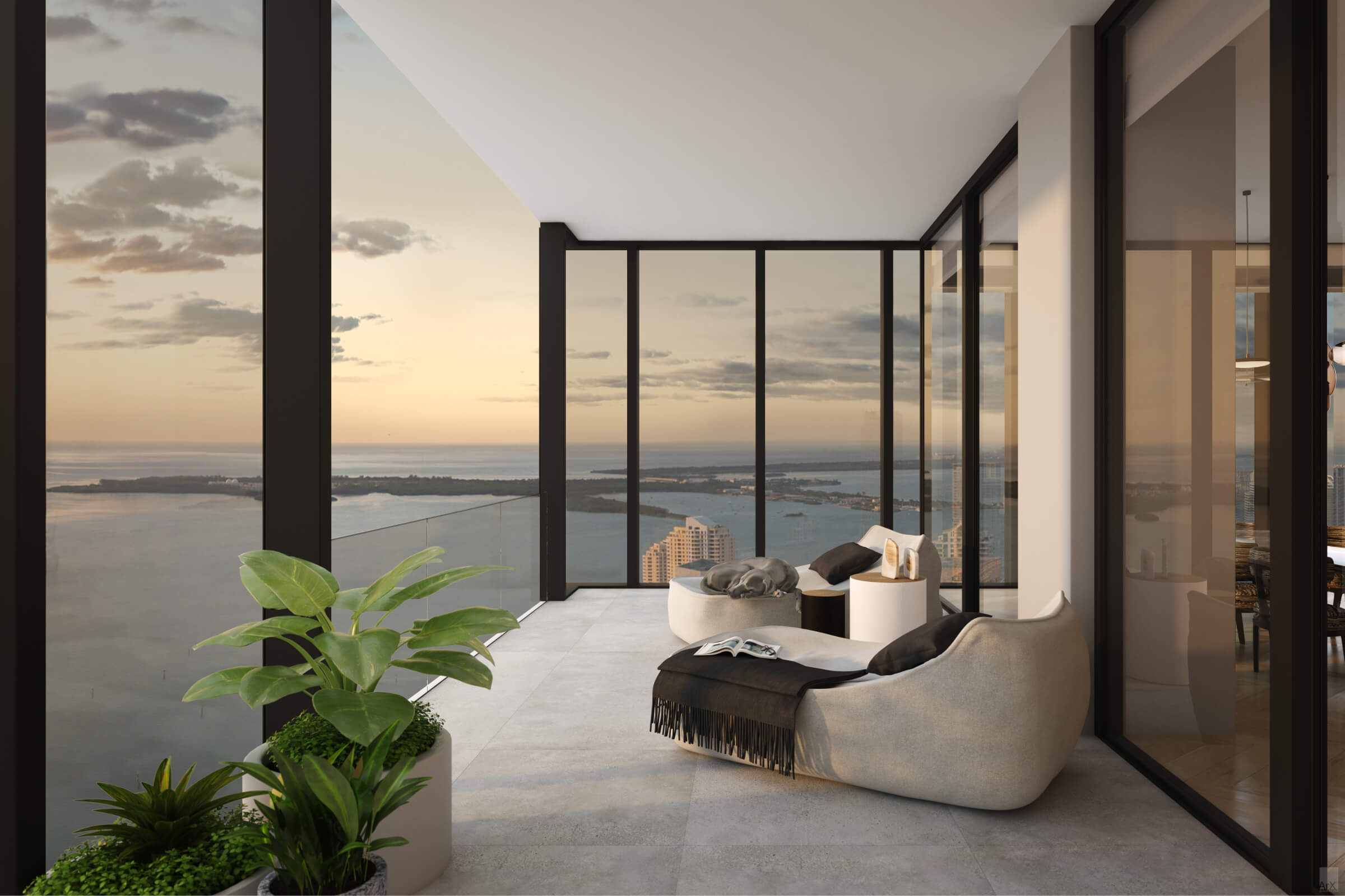 Modern balcony living area with glass walls, overlooking a sunset coastal city.